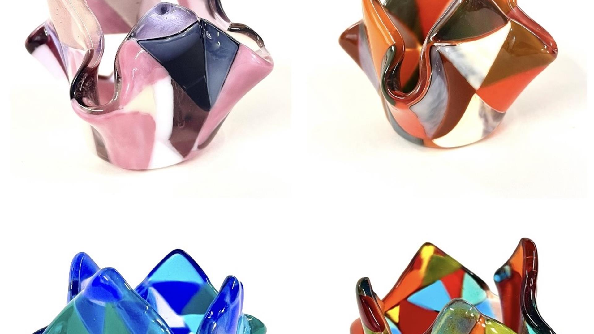 Image of 4 colourful fused glass candle holders.