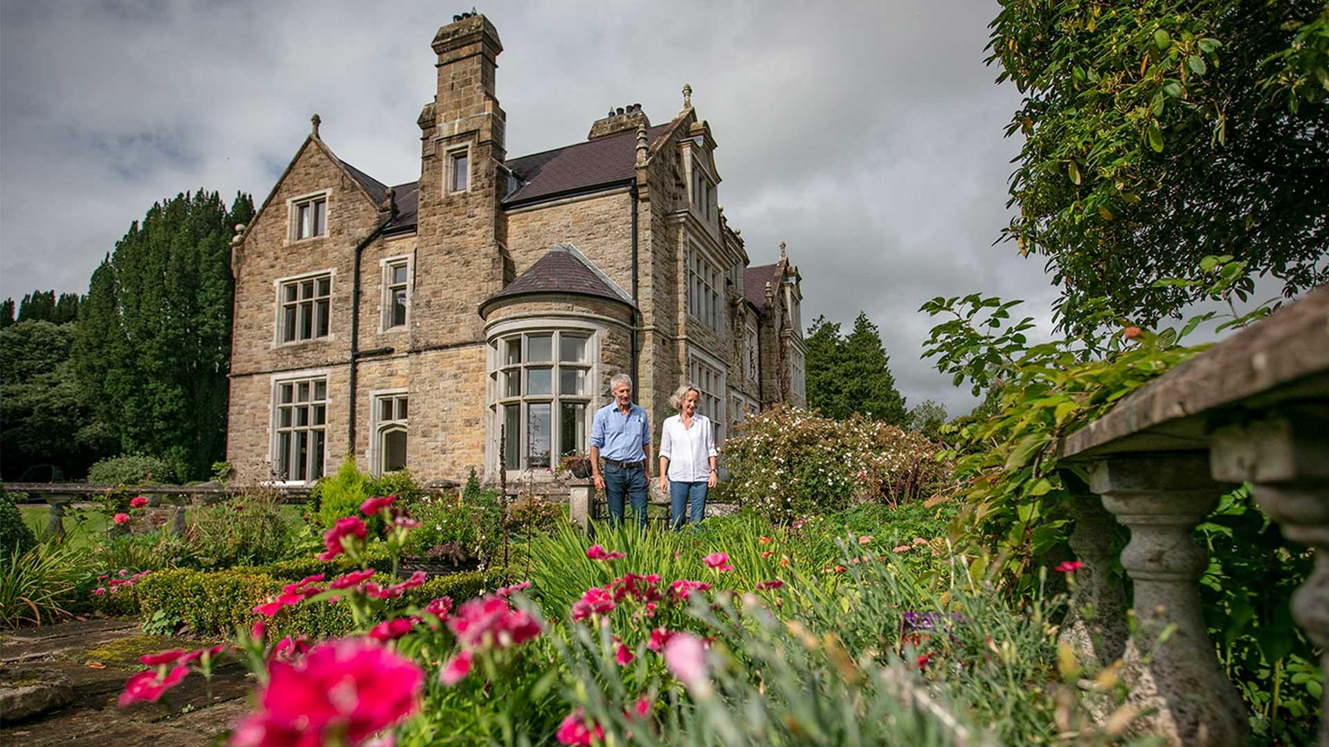 A mature couple in the garden of Blessingbourne House and estate.