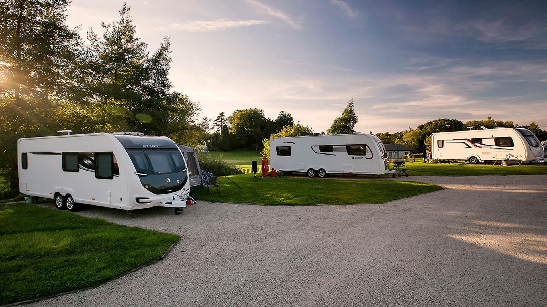 Caravans at Dungannon park in the evening sun.