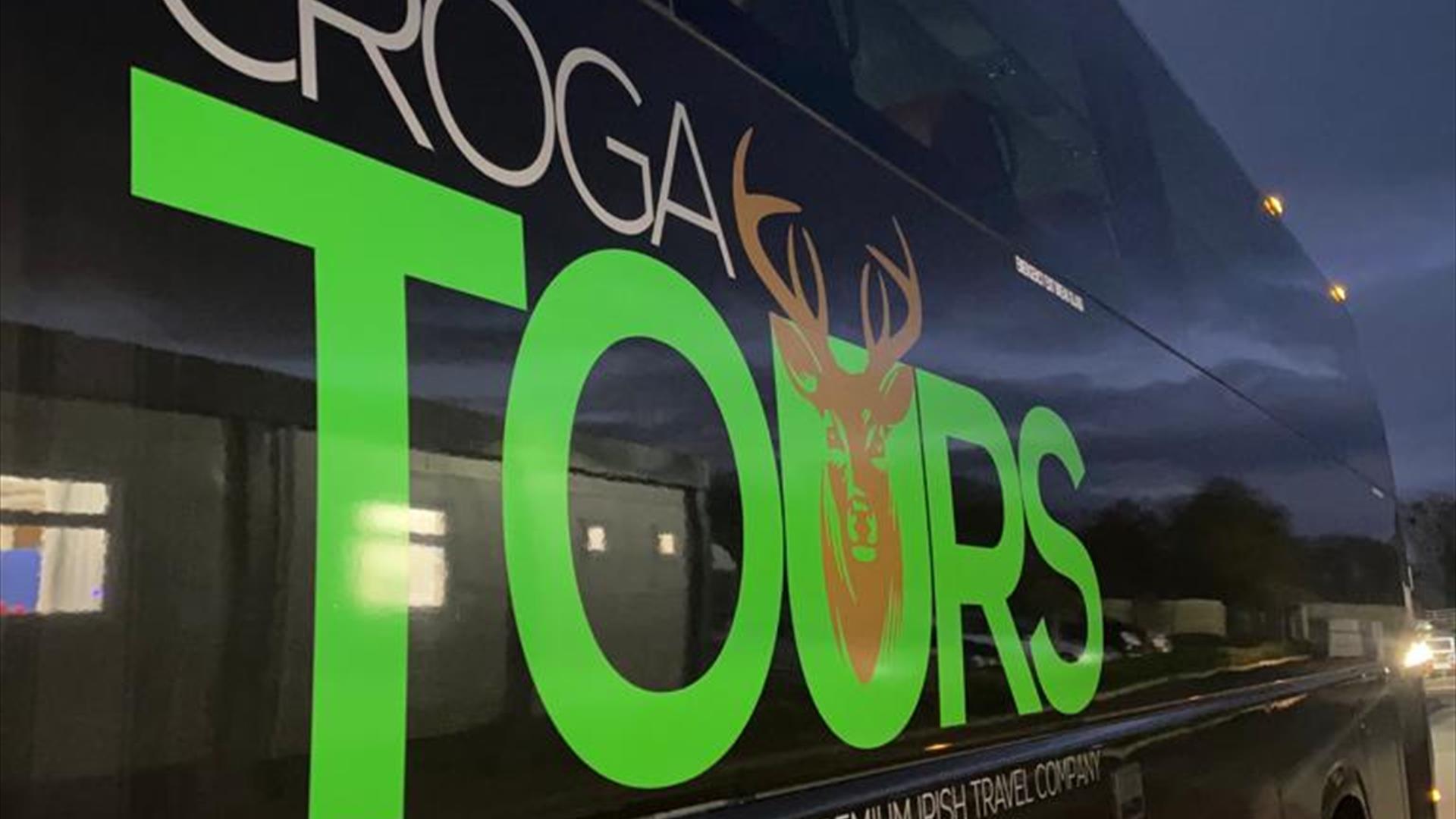 Croga tours logo on the side of a black bus