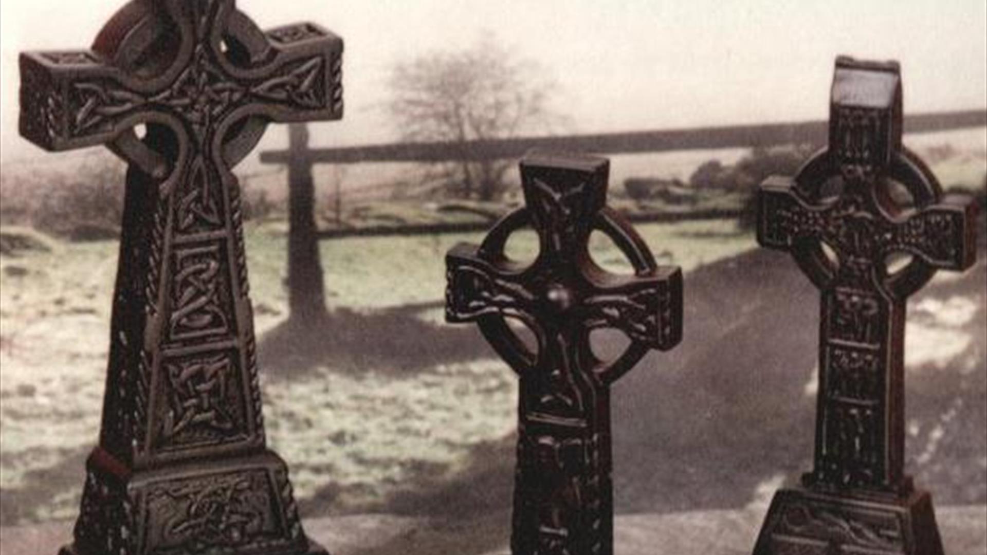 three Celtic crosses made from turf