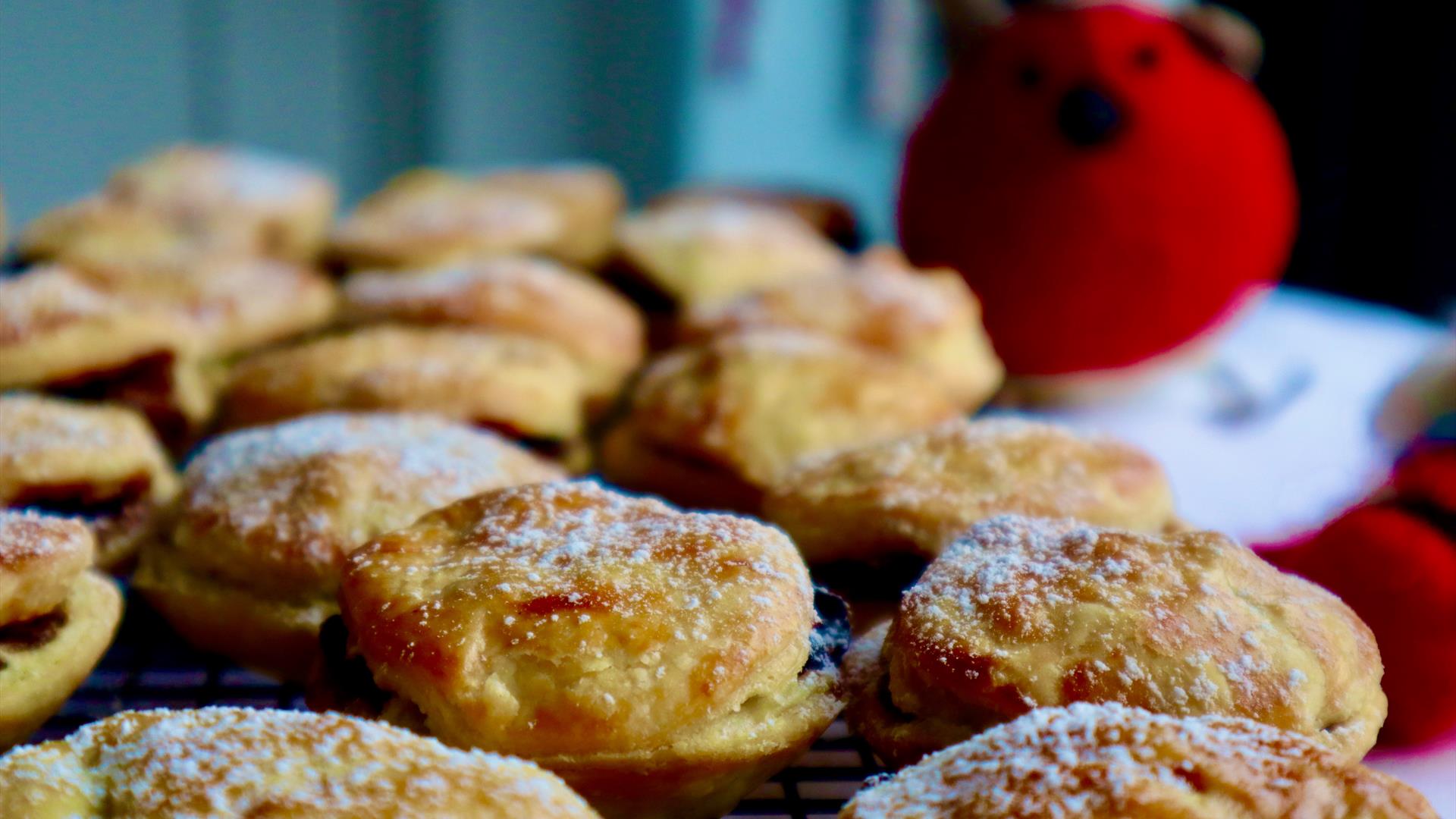 Image of homemade mine pies with a teddy robin in the background