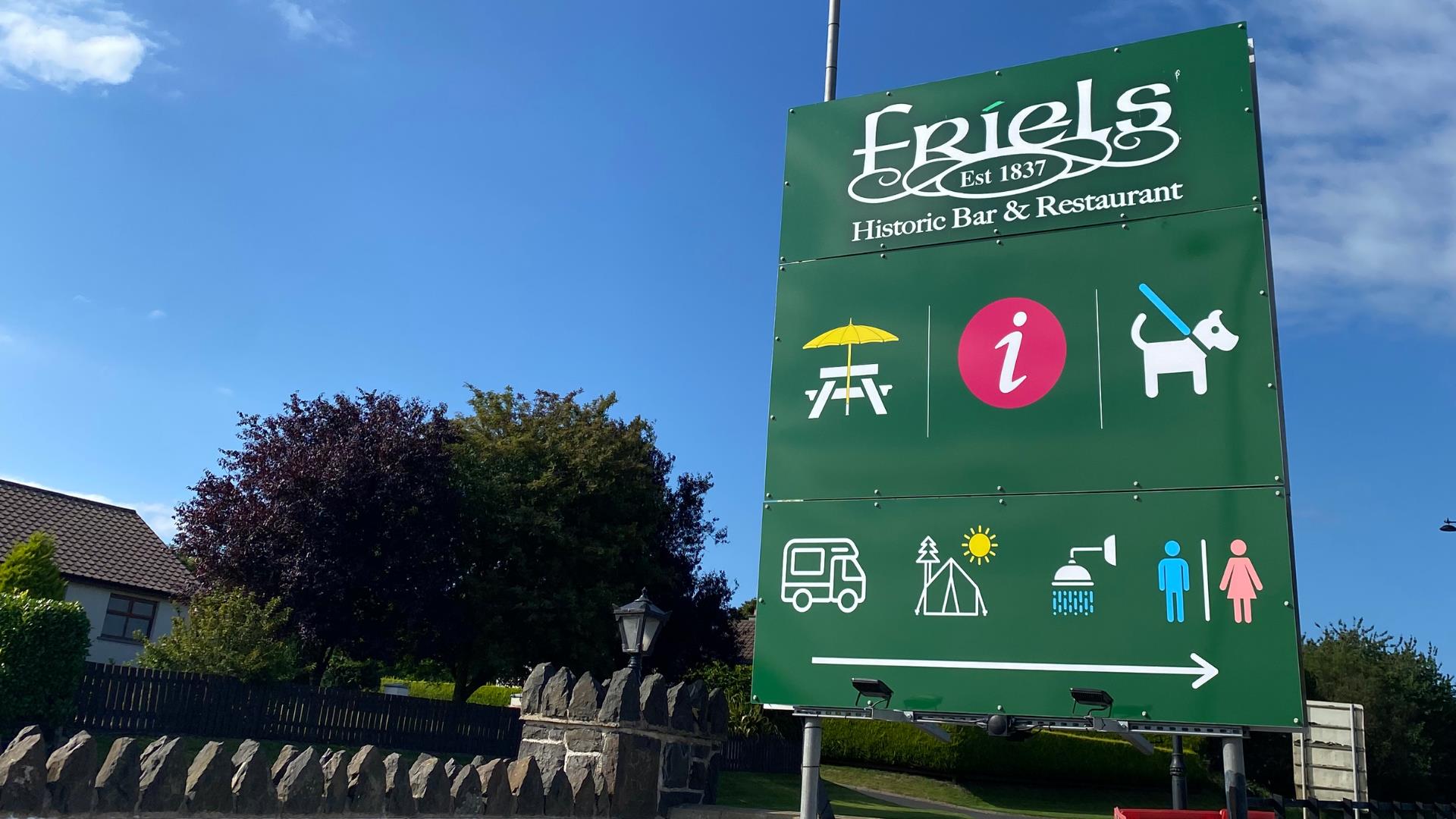 A picture of a sign post for Friels Bar and Restaurant