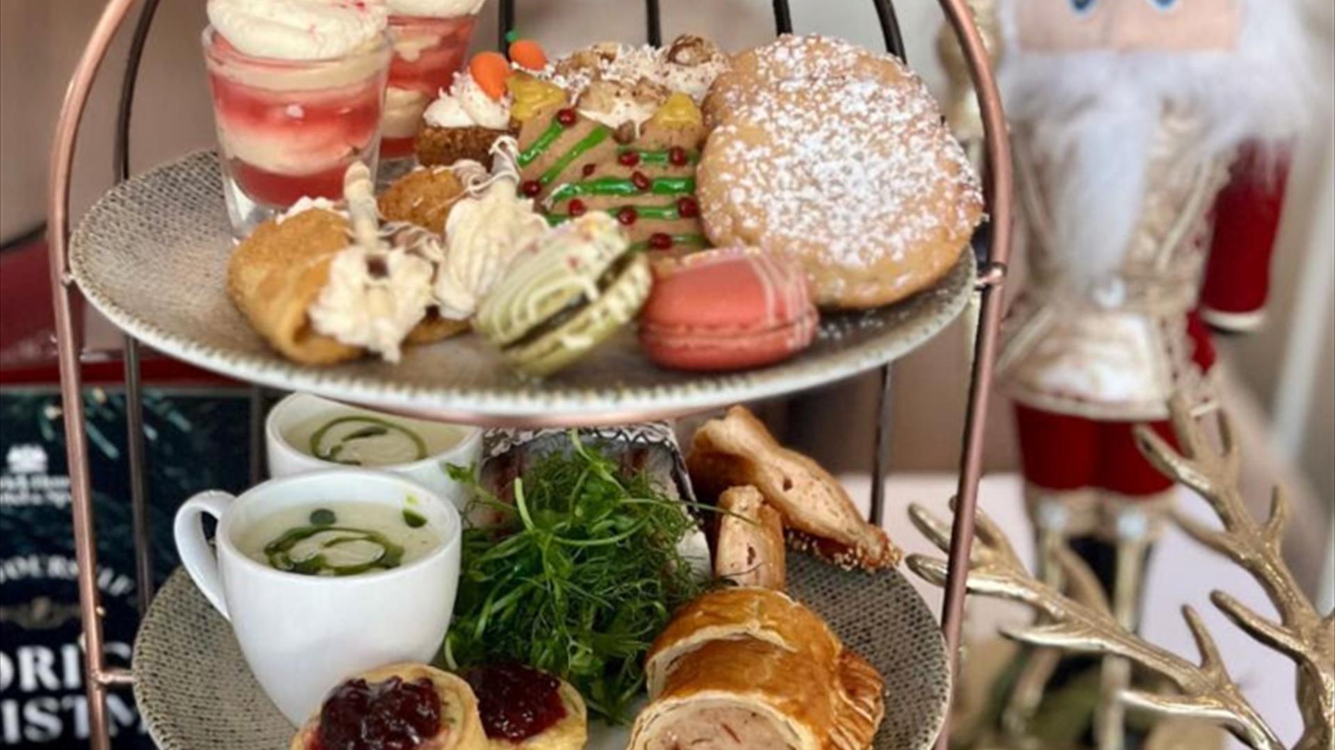 Image of an afternoon tray and a Nutcracker ornament in the background