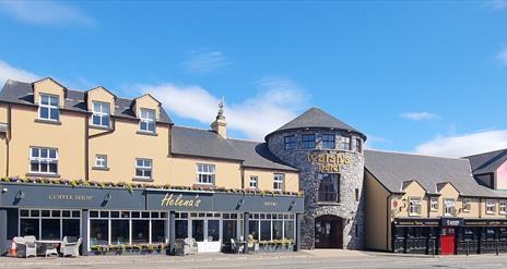 An exterior view of Walsh's Hotel in Maghera charming blend of traditional Irish architecture and modern touches.