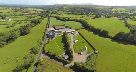 aerial view of Shepherd's Rest with surrounding green fields and mountains