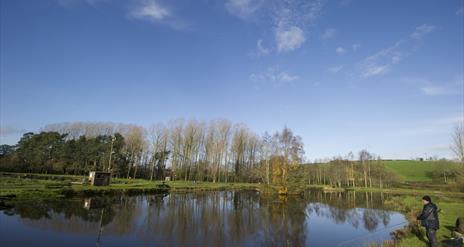 Image of a man fishing at Annaginny