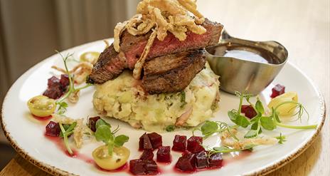 plate of steak and champ