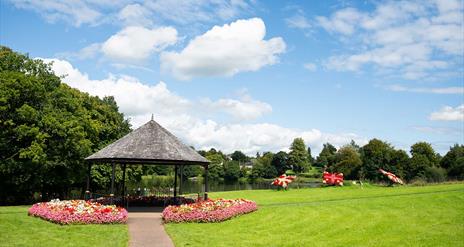 Dungannon park in the summer with floral displays by the lake