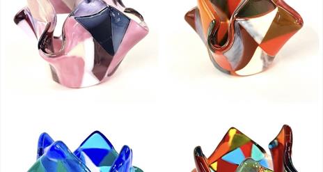 Image of 4 colourful fused glass candle holders.