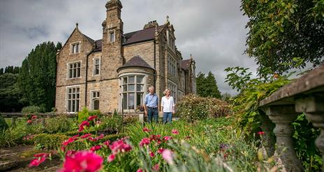 A mature couple in the garden of Blessingbourne House and estate.