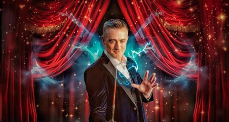 Image of Joe the magician holding a wand