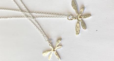 Image of two silver dragonfly necklaces