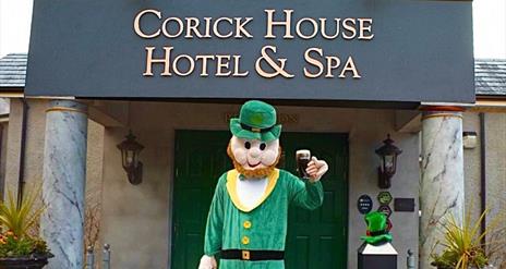 St Patrick figure standing in front of the Corick House entrance