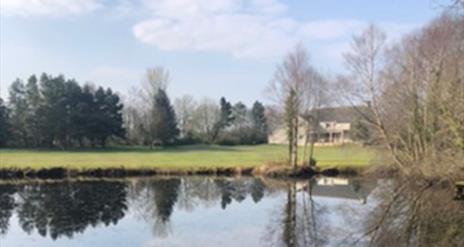 Image of the golf course over the lake