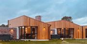 Outside image of individual lodges at The River Bann Retreat