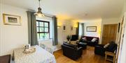 Open-plan living and dining area with seating.