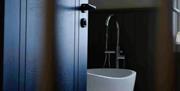Freestanding bath in contemporary bathroom.