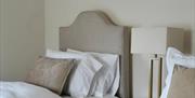 Family Room with 2 beds with bedside lamp