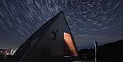 dark skies surrounding glamping pod at night