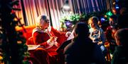 Mrs Claus talking to children