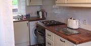 kitchen area with cream cabinets