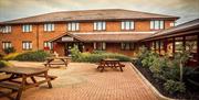 outside image of the Cohannon Inn with picnic tables to the front