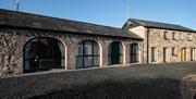 image of the arched windows in a long building