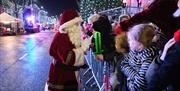 Santa greets a large crowd on the main street of Cookstown