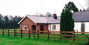 Outside image of house with wooden fence