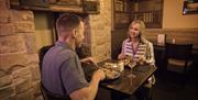 Couple having a meal in the Old Thatch Inn