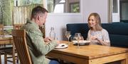 A couple eating a meal in a restaurant