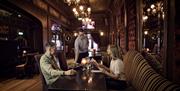 A couple in a restaurant being served