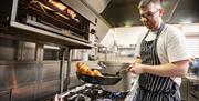 Chef cooking in restaurant kitchen