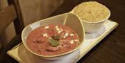 A plate of Indian curry and rice