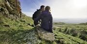 A couple looking at the view on the Sperrin Mountains