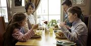 A family eating a meal in a restaurant