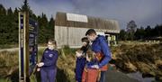 Family at start of OM Solar walk with guide