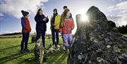 Family at Beaghmore Stone Circles with guide