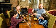 A family eating a meal in a restaurant