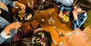 A family eating a meal in a restaurant