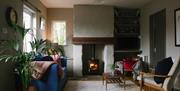 ElmTreeCottage Living area with Wood-burning stove.