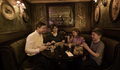 A family having a meal in Dormans restaurant