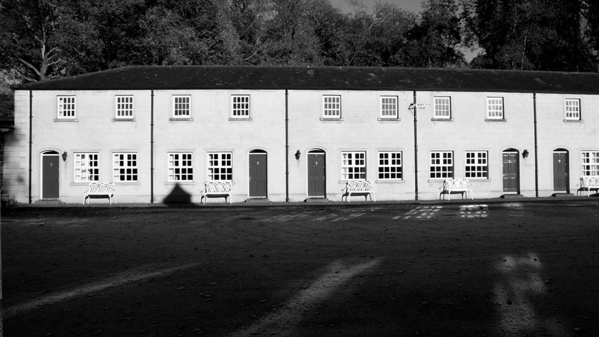 A black and white image of the front of the cottages