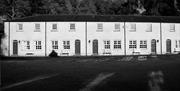 A black and white image of the front of the cottages