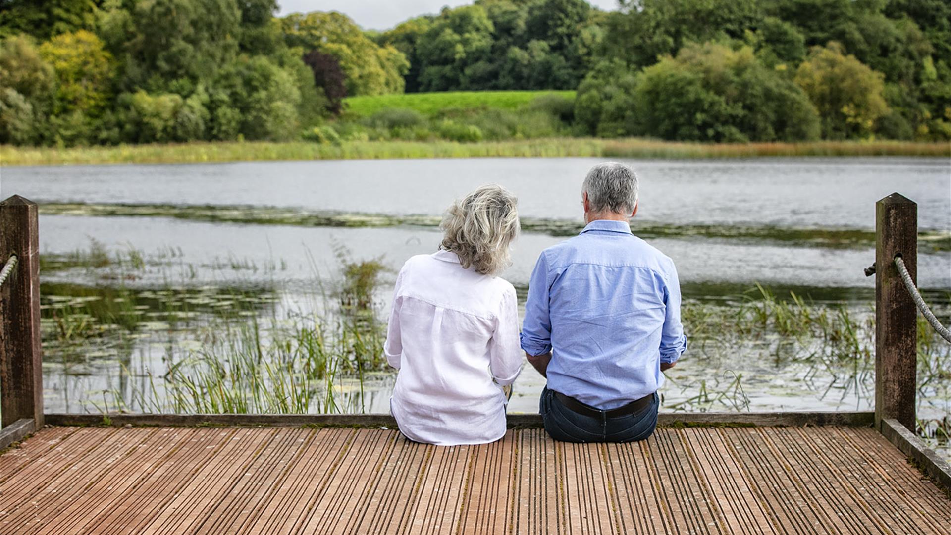 A couple sitting at the lake on Belssingbourne Estate.