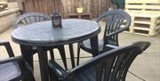 outside table and 4 chairs