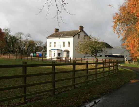 Outside photo of Kilcronaghan Centre with laneway and large grass area