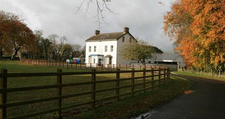 Outside photo of Kilcronaghan Centre with laneway and large grass area