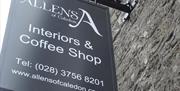 Black sign for Allens of Caledon interiors and coffee shop